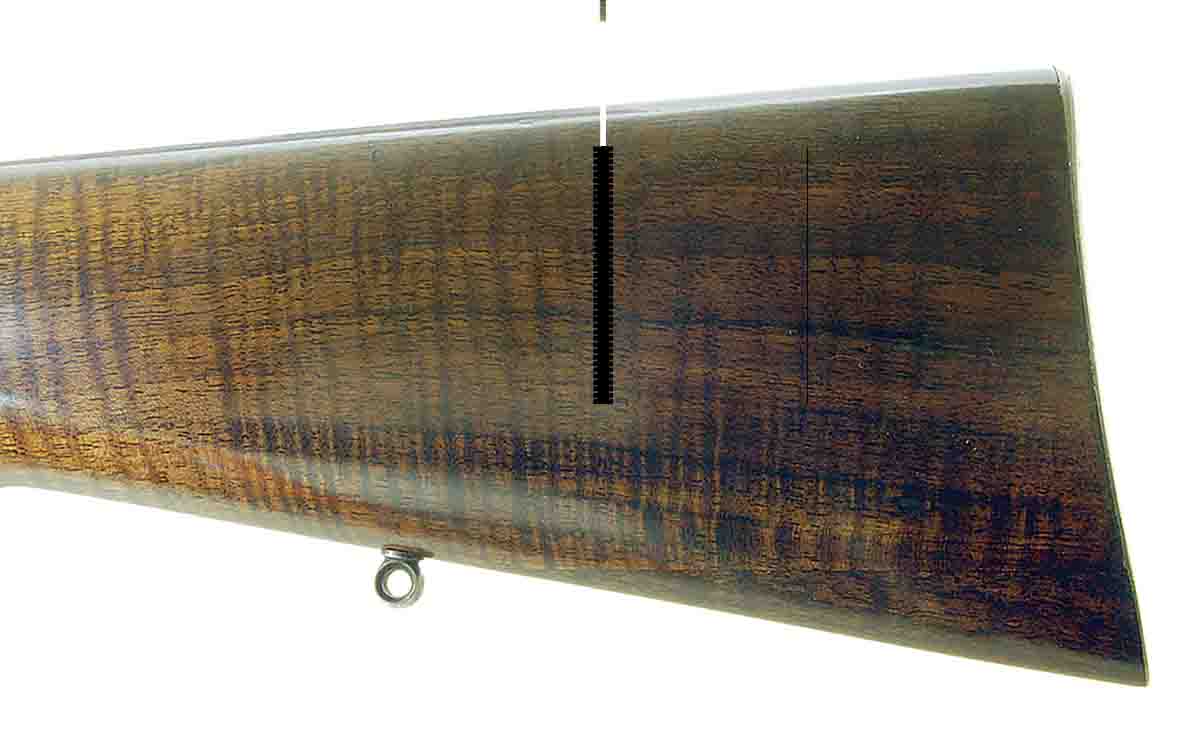 The broken toe of a Mannlicher rifle has been repaired with matching wood.